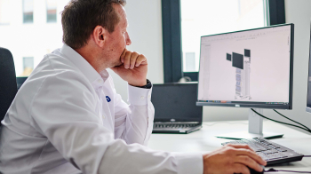 Employee sitting infront of a computer